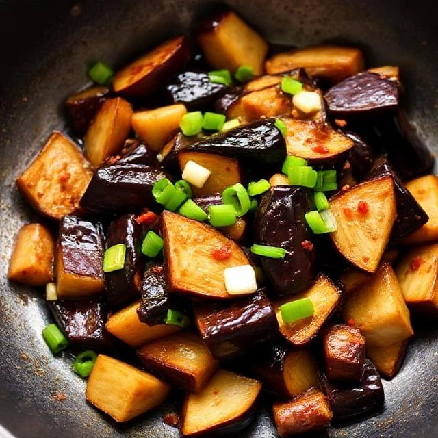 eggplant to the wok and toss to combine.